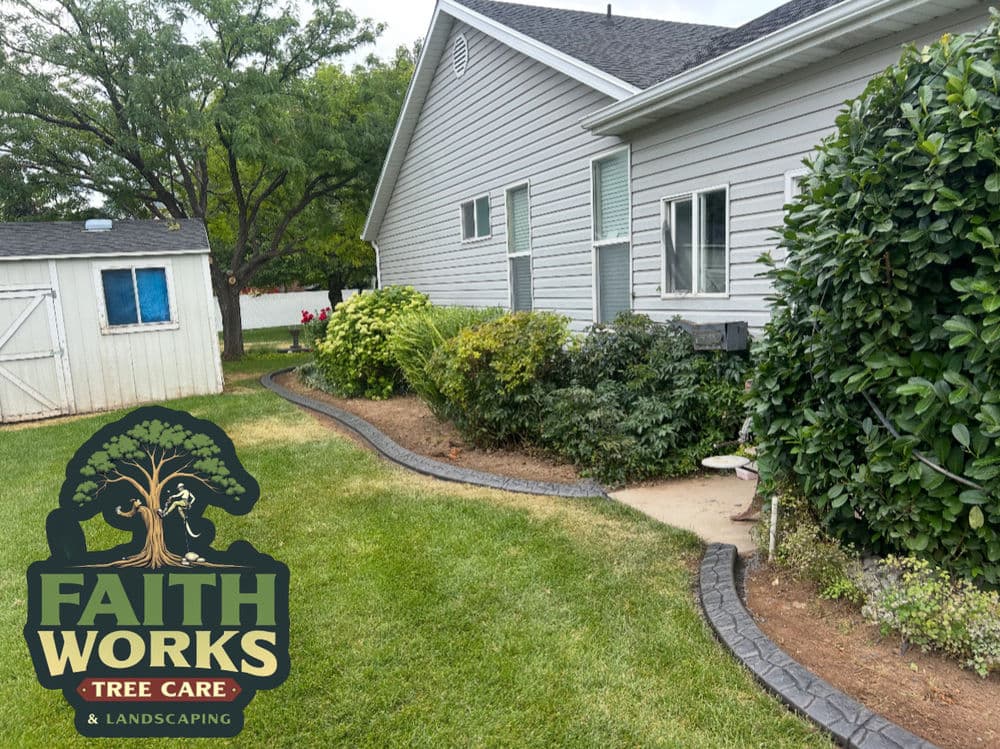 Landscaped yard featuring green shrubs, a pathway, and a shed for tree care services.