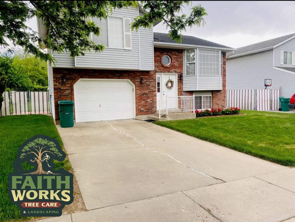 House with landscaped yard, garage, and decorative wreath, featuring Faith Works Tree Care logo.